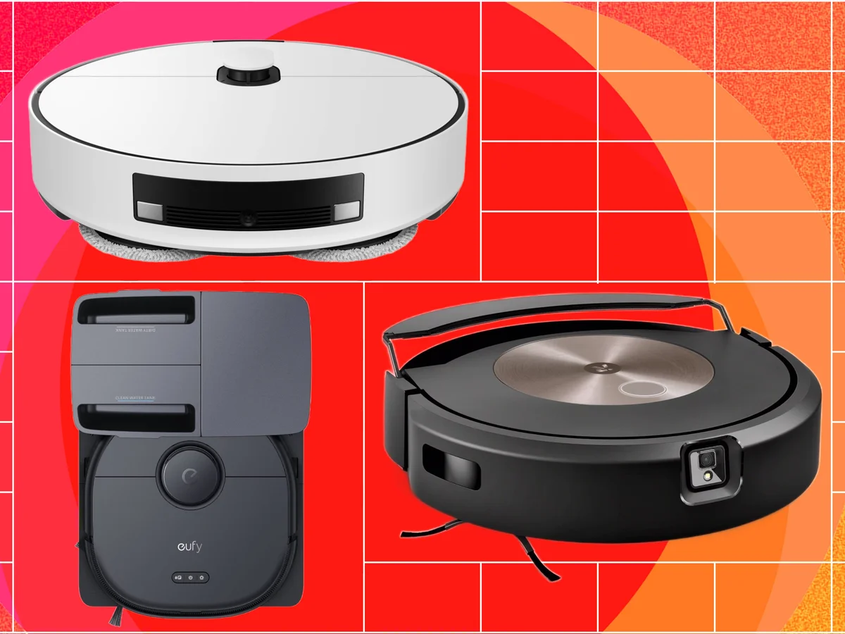 three robo vacuums on a red-orange background
